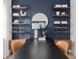 Close-up featuring a modern office with floating shelves and designer accessories at 2291 Mossy Vine Ave, St Cloud, FL 34771