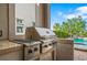 Close-up of an outdoor BBQ grill with a view of the pool and garden, perfect for entertaining at 304 Muirfield Loop, Reunion, FL 34747