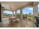 Inviting balcony with comfortable seating, offering an excellent view of the surrounding greenery at 304 Muirfield Loop, Reunion, FL 34747