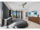 Bedroom with balcony access, showcasing view, with modern decor, and natural light at 304 Muirfield Loop, Reunion, FL 34747
