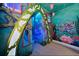 Unique, undersea-themed bedroom with custom-designed murals, lighting, and architectural details at 304 Muirfield Loop, Reunion, FL 34747