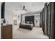 Spacious bedroom featuring a large bed, modern decor, and plenty of natural light at 304 Muirfield Loop, Reunion, FL 34747