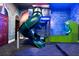 Playroom with a slide and arcade game, offering a fun and imaginative space for children at 304 Muirfield Loop, Reunion, FL 34747