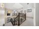 Bright stairwell with decorative iron railing, a skylight, and multiple windows letting in natural light at 304 Muirfield Loop, Reunion, FL 34747