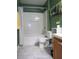 Bathroom with white toilet, vanity, and shower-tub combination with grey marble floors at 3055 Leflore Ln, Orlando, FL 32833