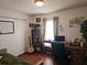Inviting bedroom with a cozy work space and dark wooden furniture at 3055 Leflore Ln, Orlando, FL 32833