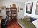 Comfortable bedroom featuring a working desk and reading materials at 3055 Leflore Ln, Orlando, FL 32833