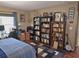 Comfortable bedroom with personal library, desk and music collection at 3055 Leflore Ln, Orlando, FL 32833