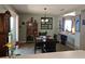 Inviting dining area with a modern light fixture, sliding door access to the backyard, and lovely decor at 3055 Leflore Ln, Orlando, FL 32833
