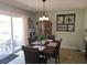 Cozy dining room featuring a rustic light fixture, backyard view, and comfortable seating at 3055 Leflore Ln, Orlando, FL 32833