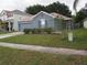 Charming single-story home featuring well-maintained landscaping and an attached two-car garage at 3055 Leflore Ln, Orlando, FL 32833