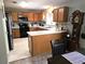 Functional kitchen featuring ample cabinetry, white countertops, and modern appliances at 3055 Leflore Ln, Orlando, FL 32833