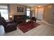 Inviting living room with comfortable seating, a classic area rug, and neutral wall color at 3055 Leflore Ln, Orlando, FL 32833