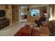 Inviting living room featuring tile floors, tan walls, and comfortable seating arrangement at 3055 Leflore Ln, Orlando, FL 32833