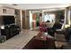 Inviting living room featuring tile floors, neutral walls, and an open flow into the kitchen at 3055 Leflore Ln, Orlando, FL 32833