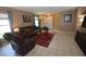 Inviting living room with tile floors, neutral walls, and a cozy seating area at 3055 Leflore Ln, Orlando, FL 32833