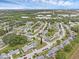 An aerial view of the community, showcasing the well-maintained streets and tree coverage at 3162 Little Sound Dr, Orlando, FL 32827