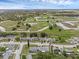 Aerial view of a residential area with homes near open green space and trees at 3162 Little Sound Dr, Orlando, FL 32827
