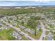 Wide aerial view of the residential neighborhood with green landscape and tree coverage at 3162 Little Sound Dr, Orlando, FL 32827