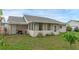 Wide backyard view featuring the screened-in porch of a single-story home at 3162 Little Sound Dr, Orlando, FL 32827