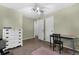 Spacious bedroom illuminated by a ceiling fan, featuring a classic dresser and versatile furnishings at 3162 Little Sound Dr, Orlando, FL 32827