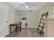Bright bedroom bathed in natural light, featuring a ceiling fan, desk, and stylish accents at 3162 Little Sound Dr, Orlando, FL 32827