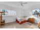 Bright bedroom with a large window, ceiling fan and terrazzo floor at 3162 Little Sound Dr, Orlando, FL 32827