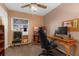 Small bedroom or home office with wood desk, rolling chair and lots of natural light at 3162 Little Sound Dr, Orlando, FL 32827