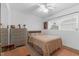 Bedroom with ceiling fan, neutral decor, window and dresser at 3162 Little Sound Dr, Orlando, FL 32827