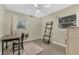 Cozy bedroom bathed in natural light, complete with a ceiling fan, desk, and stylish accents at 3162 Little Sound Dr, Orlando, FL 32827