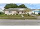 Charming single-story home featuring a manicured lawn and a welcoming entryway at 3162 Little Sound Dr, Orlando, FL 32827