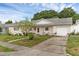 Cozy home with a well-maintained lawn and convenient driveway to the attached garage at 3162 Little Sound Dr, Orlando, FL 32827