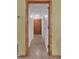 Hallway with hardwood trim, doors, and a closet at 3162 Little Sound Dr, Orlando, FL 32827