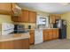 Practical kitchen with efficient appliances and a bright, sunny window at 3162 Little Sound Dr, Orlando, FL 32827