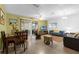 A bright living room features tile floors, furniture, and natural light from sliding glass doors at 3162 Little Sound Dr, Orlando, FL 32827