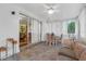 Relaxing sunroom features tiled floors, plenty of light, and cozy wicker seating at 3162 Little Sound Dr, Orlando, FL 32827