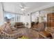 Enclosed patio with tile floor, sliding glass doors, wicker furniture and ceiling fan at 3162 Little Sound Dr, Orlando, FL 32827