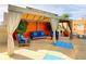 Outdoor cabana featuring comfortable lounge seating, privacy curtains, and serene patio area for relaxation and enjoyment at 322 E Central Blvd # 1612, Orlando, FL 32801