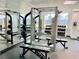 Well-equipped gym featuring weightlifting machines, free weights, and mirrors at 322 E Central Blvd # 1612, Orlando, FL 32801