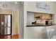 A condo kitchenette offers sleek stainless appliances and counter seating at 322 E Central Blvd # 1612, Orlando, FL 32801