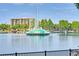 Picturesque lake view highlighting a water fountain feature and distant building architecture, providing scenic serenity at 322 E Central Blvd # 1612, Orlando, FL 32801