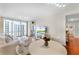 Bright living room featuring a large window with views and comfortable white furnishings at 322 E Central Blvd # 1612, Orlando, FL 32801