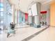Expansive condo lobby with sleek tiled floors, modern columns, and contemporary decor at 322 E Central Blvd # 1612, Orlando, FL 32801