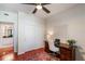Home office with wooden desk, comfortable chair, and closet for extra storage at 322 E Central Blvd # 1612, Orlando, FL 32801