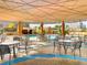 Covered pool area featuring outdoor seating, tables, and views of the city skyline at 322 E Central Blvd # 1612, Orlando, FL 32801