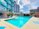 Beautiful pool area with comfortable lounge chairs and stylish sun shades at 322 E Central Blvd # 1612, Orlando, FL 32801