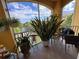 Relaxing screened balcony with plants and beautiful views at 3338 Robert Trent Jones Dr # 30704, Orlando, FL 32835