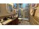 Bathroom with a walk-in shower that features neutral tile and a built-in bench at 3338 Robert Trent Jones Dr # 30704, Orlando, FL 32835