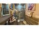 Bathroom with a walk-in shower that features neutral tile and a built-in bench at 3338 Robert Trent Jones Dr # 30704, Orlando, FL 32835