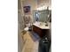 A full bathroom featuring a glass door shower and dark wood vanity with tile flooring at 3338 Robert Trent Jones Dr # 30704, Orlando, FL 32835